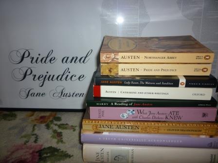 A selection of my Austen-related book collection...in front of my A0 sized full-text poster of 'Pride and Prejudice'. Obsessive? Me?